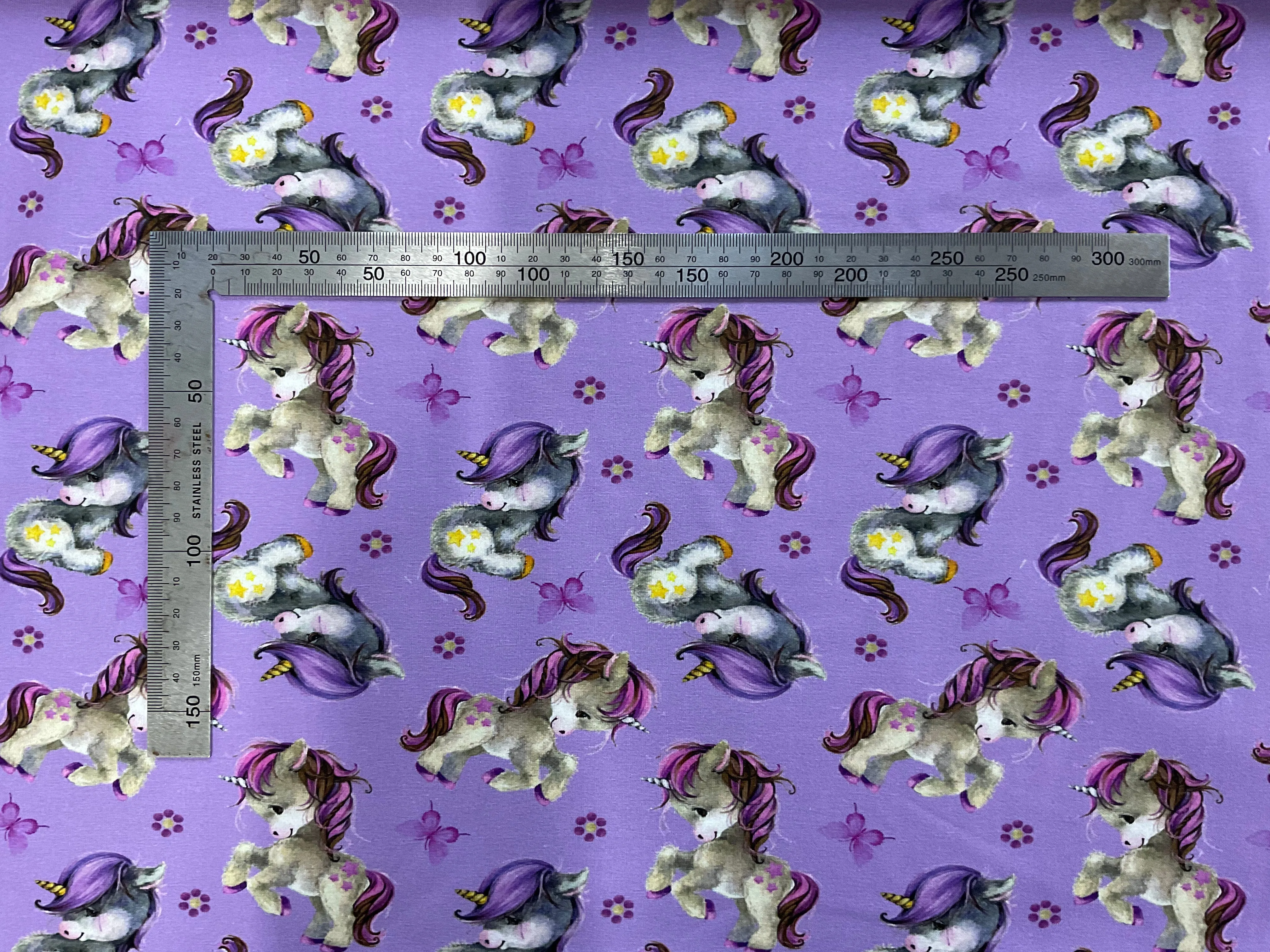 Cute Unicorns on Lilac Cotton Jersey Fabric